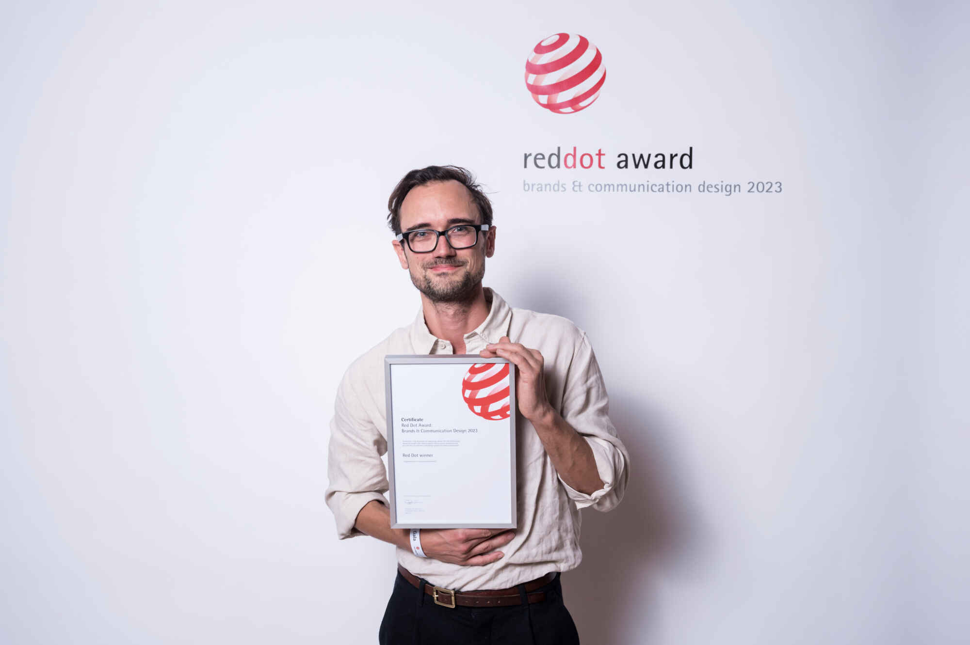 This image shows the logo of the Red Dot Design Award 2023, which Identity Lab won.